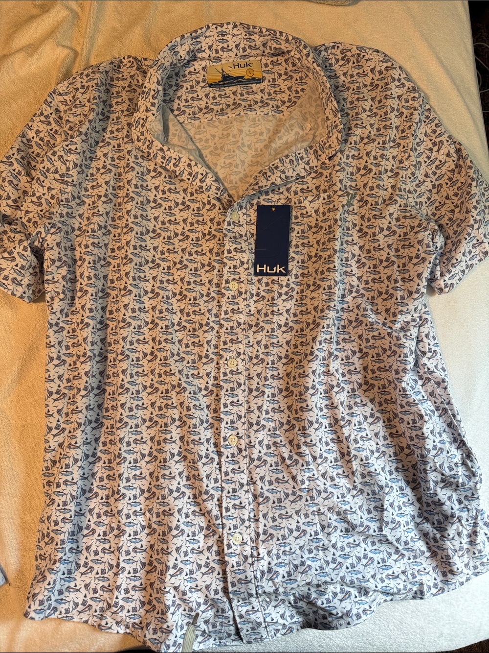 Huk Men’s Short Sleeve Button-Down Shirt in White with Navy Fish Print